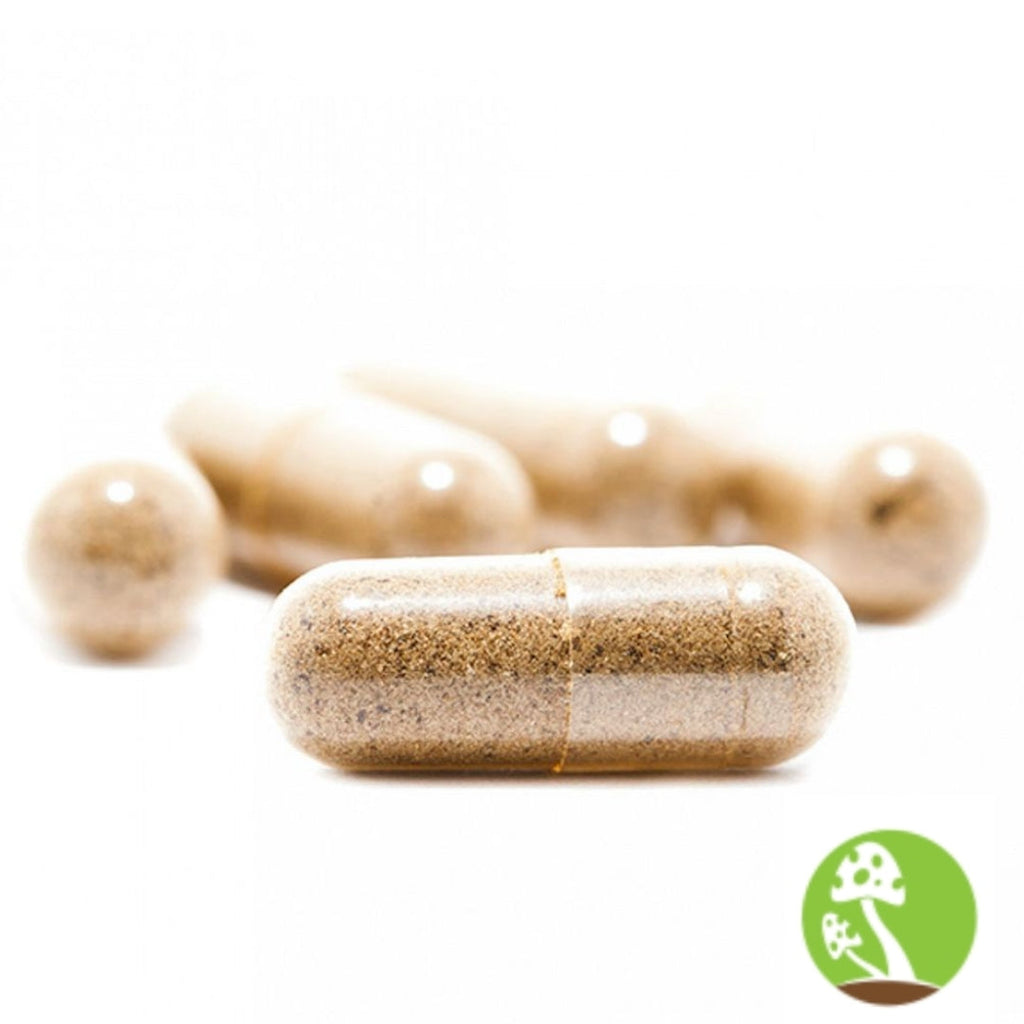 Close-up of a capsule with a blurred background and a green logo in the corner.