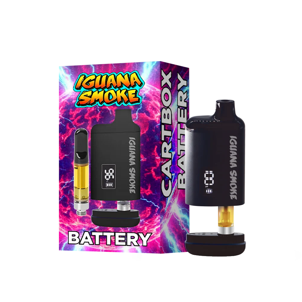 A black Iguana Smoke Cartbox Battery vape device standing next to its colorful retail box featuring a purple, pink, and blue lightning design with the text 'IGLIANA SMOKE' and 'BATTERY'.