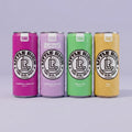 Four colorful cans of Little Rick drinks on a light gray background