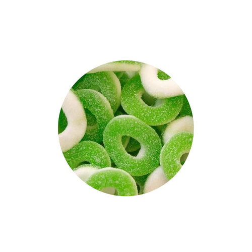 Green and white gummy candy rings on a white background