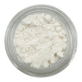 Clear container filled with white cosmetic powder on a white background