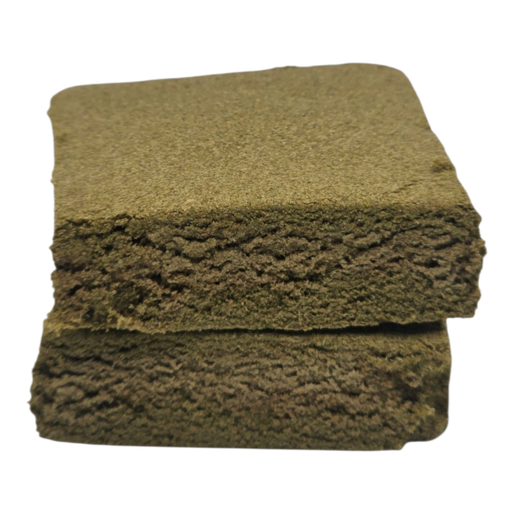 Stack of green sponges on a white background