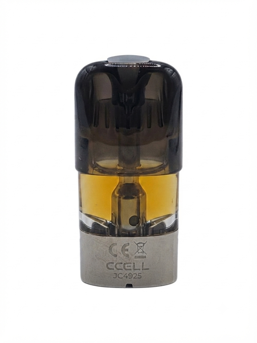 A CCELL disposable vape device with a translucent dark brown top section, amber-colored liquid inside, and a metallic silver base, shown on a plain white background.