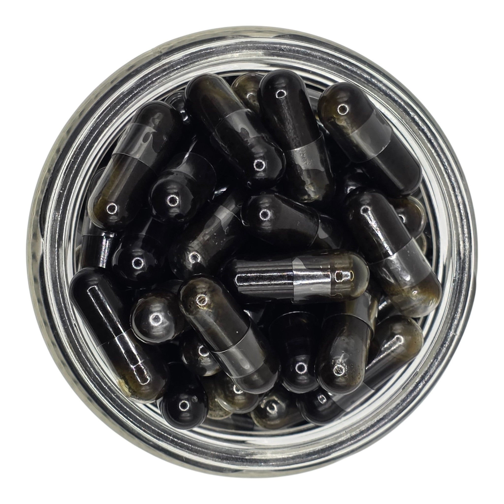 Clear jar filled with black and transparent bullet-shaped objects on a white background