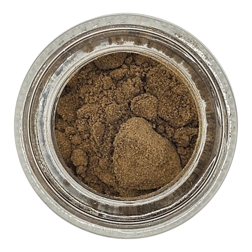 Small container of brown powder on a white background